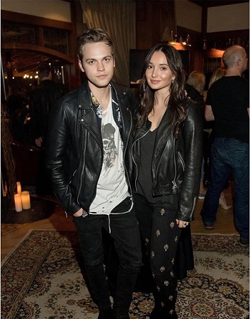 Alexander posing with his wife Jenna Berman